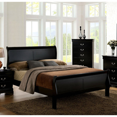 Lit grand format avec pieds en bois massif et support pour cadre de chambre noir style transitionnel
