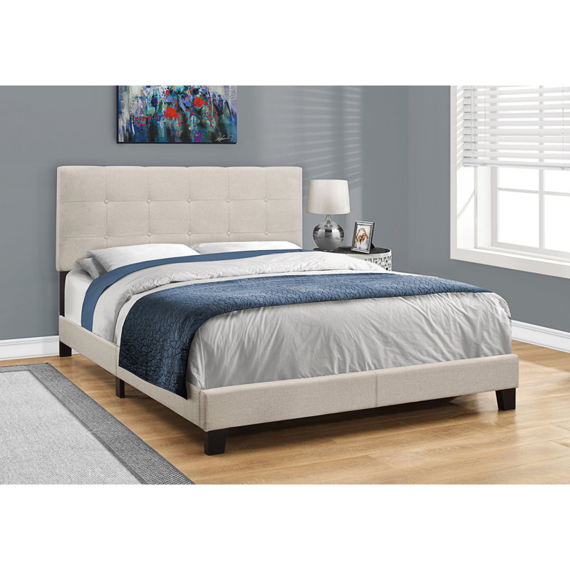 Grand lit tapissier avec tête de lit capitonnée élégante