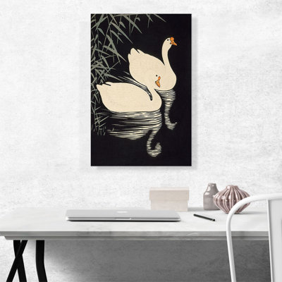 " White Chinese Geese Swimming By Reeds "