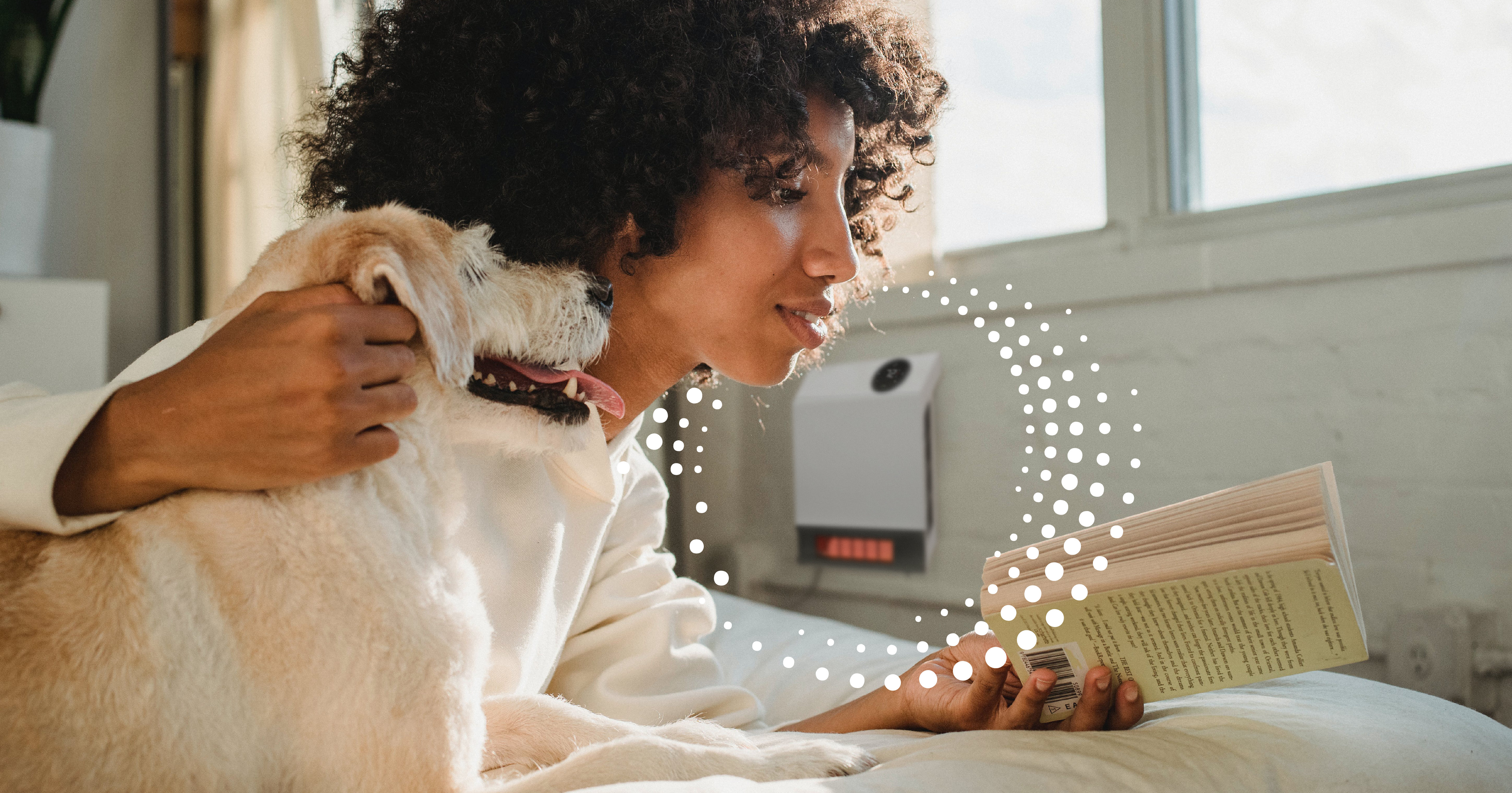 Dog and women reading in front of a heat storm heater