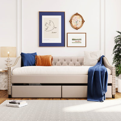 Lit de jour avec deux tiroirs en beige doux et construction en lattes de bois robustes - Apportez une atmosphère paisible à votre espace de vie et une structure résiliente
