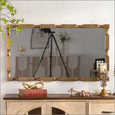 Miroir mural doré