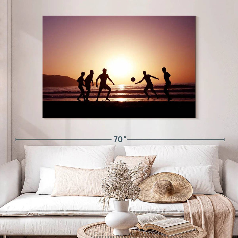 Silhouette de soccer sur la plage Sireci