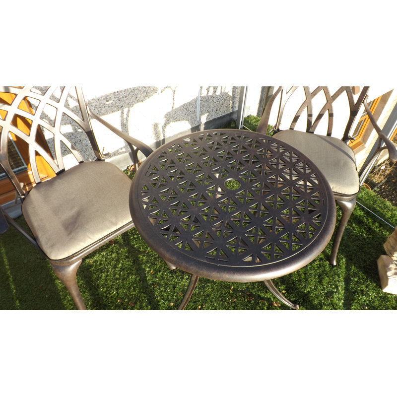 Ryne 2 - Person Patio Dining Set with Round Table , Cushions Included, Bronze