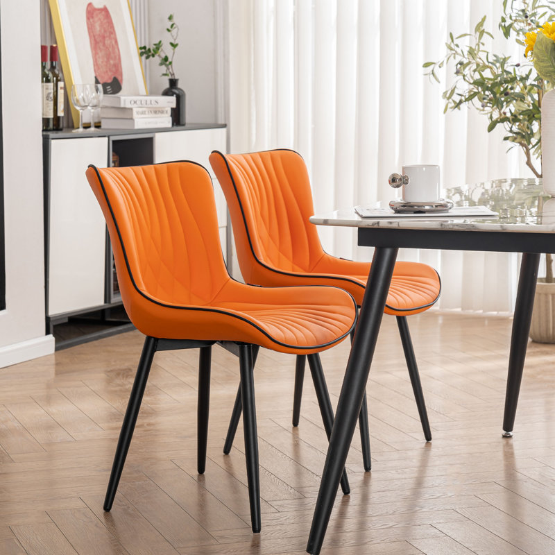 Chaise à oreilles rembourrée en similicuir Jimma avec pieds en fer, Orange