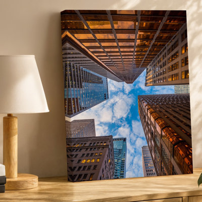 Canvas A Dramatic Upward View Of Towering Skyscrapers Their Glass And Wall Art Steel Facades Reflecting Warm Golden And Orange Hues Of Canvas Wall Art
