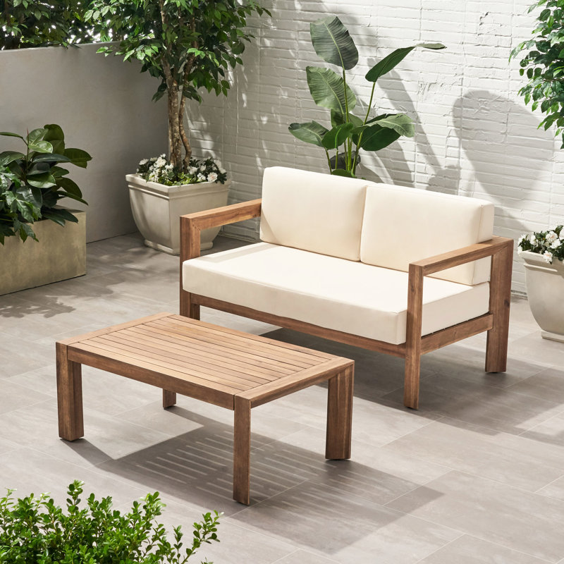 Table basse en bois avec coussins imperméables et lattes ouvertes, table d'extérieur beige brun, coussins résistants aux intempéries