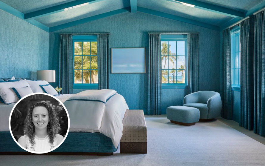 Portrait of interior designer in a blue bedroom.