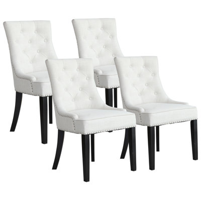Chaise capitonnée beige rembourrée 