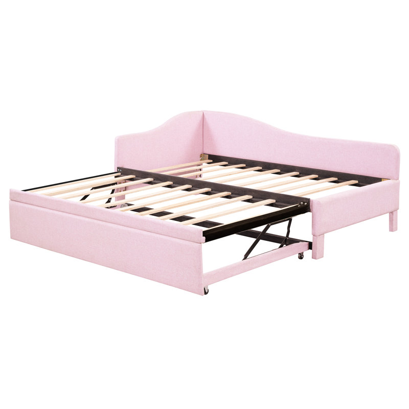 Lit de jour rembourré en L rose avec lit gigogne extensible, idéal pour une taille convertible en très grand lit