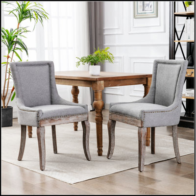 Chaise de salle à manger rétro en tissu épaissi avec pieds en bois massif pour plus de confort et de style