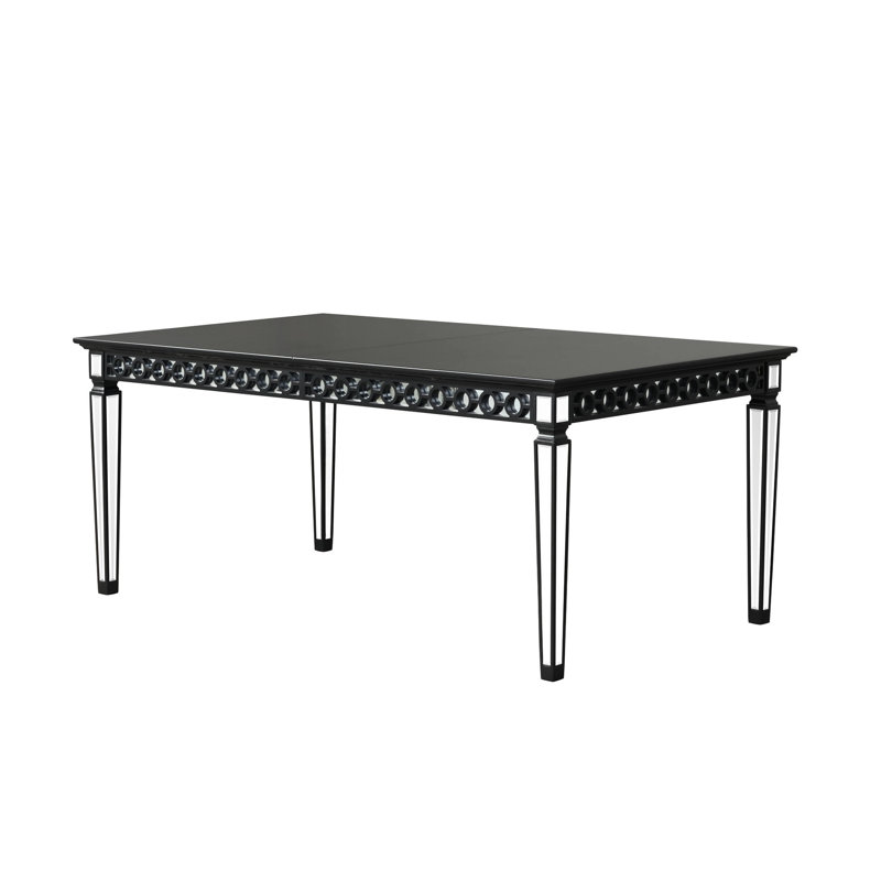 Élégante table de salle à manger noire avec tablier géométrique et plateau rectangulaire en bois avec décoration en miroir