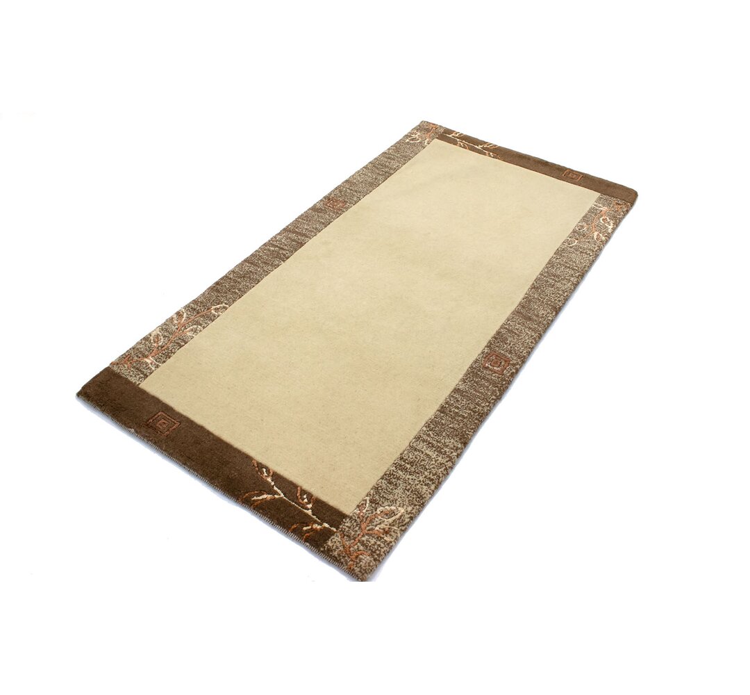 Handgefertigter Teppich Madalynn in Beige