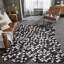 Breyen Cowhide Patchwork Area Rug in Black/White/Brown-1453417518