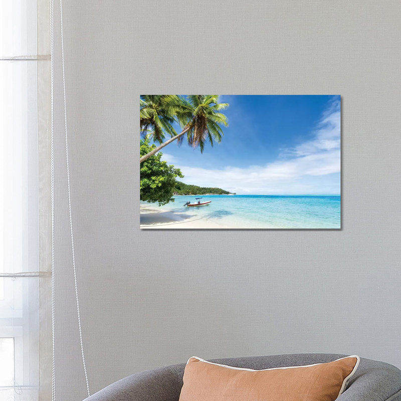 Idyllic Beach With Palm Trees And Boat On Bora Bora by Jan Becke - Wrapped Canvas Gallery-Wrapped Canvas Giclée