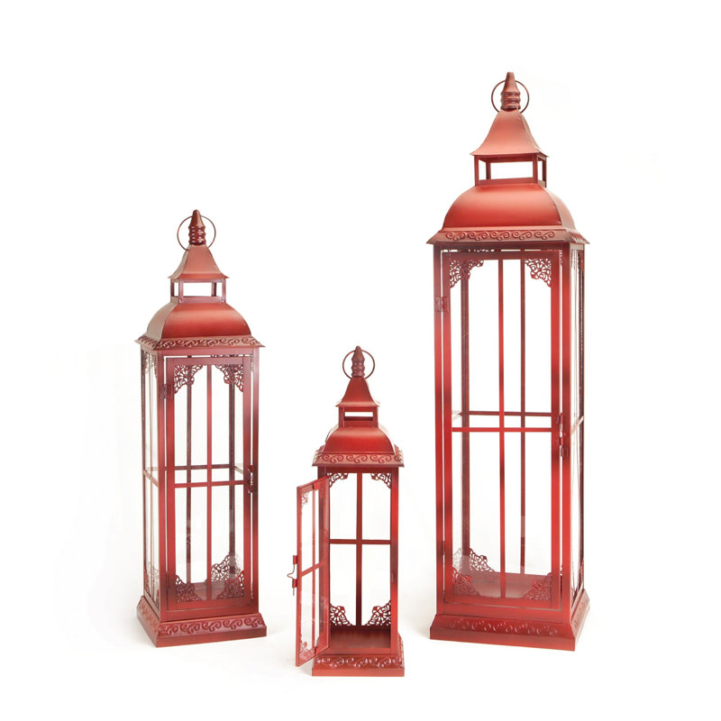 Ensemble de trois bougeoirs de lanterne de plancher en métal orné de verre rouge patiné