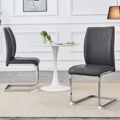 Luxury Simple Arch Chair - Set Of 2 PU Material High Resilience Dining Chair With Arched Metal Silver Leg.