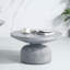 Table basse avec base piédestal en gris patiné