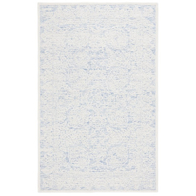 Tapis bleu / ivoire en coton et laine touffetés à la main Kayllie