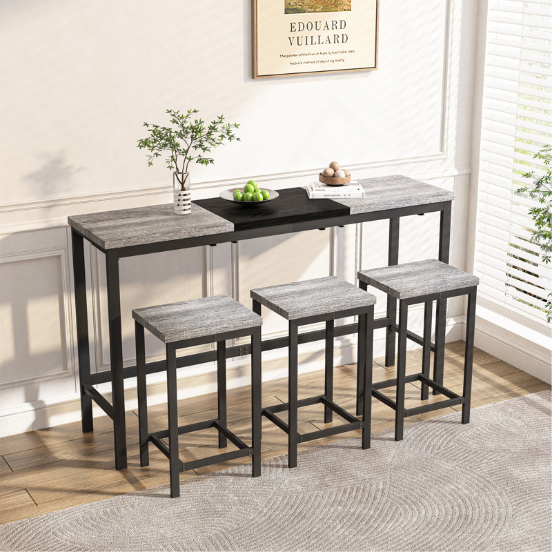 Table de salle à manger moderne avec 3 tabourets, gris et noir. Matériaux, idée de tabouret suspendu pour les bars