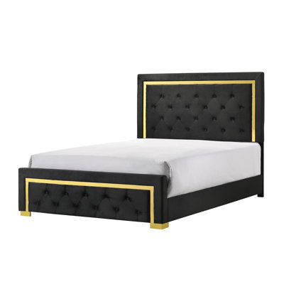 Grand lit tapissier glamour en tissu noir avec détails dorés et pieds élégants