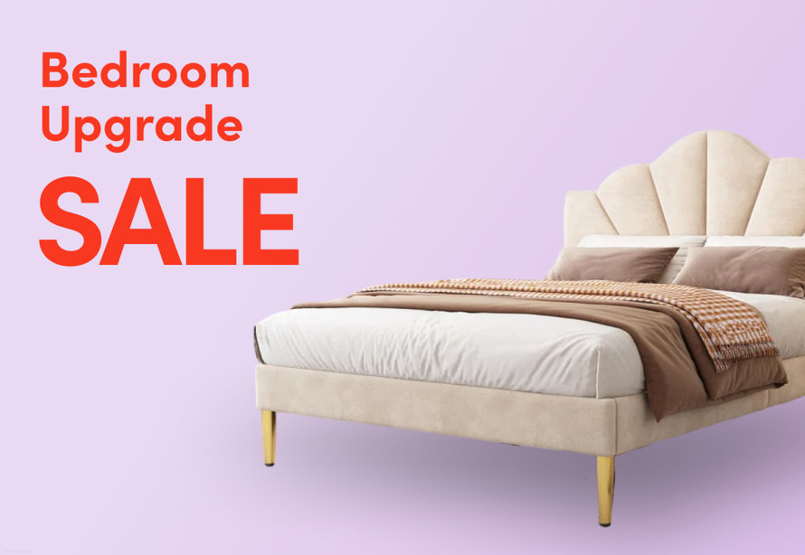 Bedroom Upgrade Sale promotional banner featuring a cream velvet bed with scalloped headboard and brown bedding on a lavender background