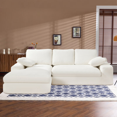 White Corduroy Compressed Sofa. It Has A Soft And Skin-Friendly Sitting Feel, Adding A Healing Atmosphere To The Warm Living Room. It Comes With 3 Back Cushions And 2 Throw Pillows.