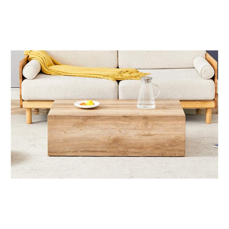 Rehaussez votre espace de vie avec cette table basse moderne en panneau de fibres à densité moyenne qui présente des motifs de texture de couleur bois clair et doux. Il est caractérisé par un design élégant.