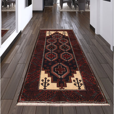 Tapis rouge en laine noué à la main
