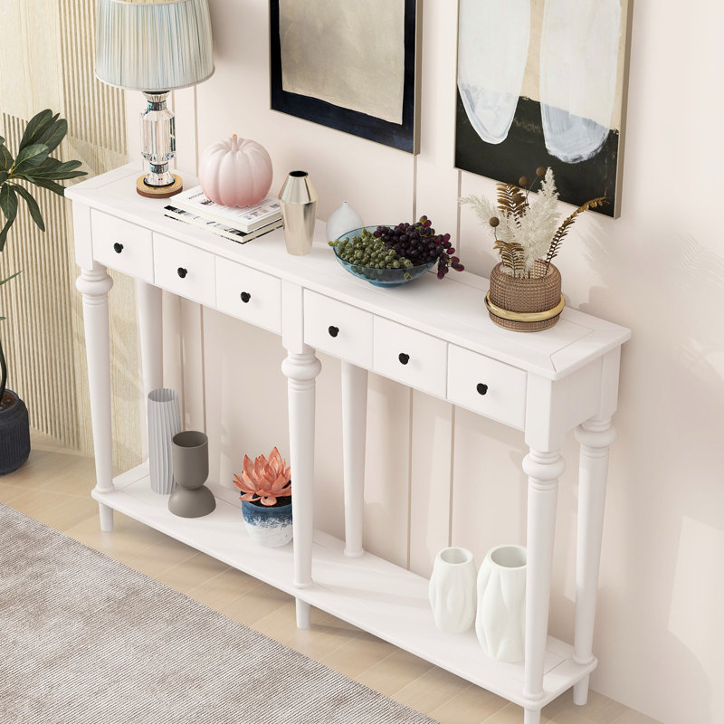Console blanche By. 4 tiroirs et tablette ouverte. Finition pin rustique. Pin. Idéal pour les entrées, les salons et les couloirs. Assemblage rapide blanc. Style à 4 tablettes. Look rétro avec placage.