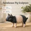 Statue de jardin en forme de cochon tacheté