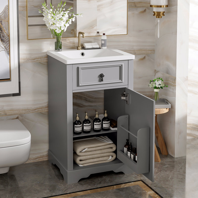 Meuble-lavabo de 20 pouces avec lavabo en céramique, porte à fermeture douce, tablette réglable et support de rangement fixé à la porte