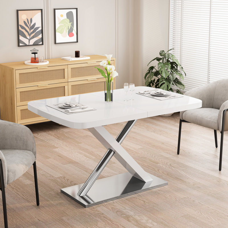 Table de salle à manger extensible blanche de 47,25 po à 63 po, pour 4 à 6 personnes, avec base en métal et plateau brillant en blanc, base en tubes d'acier inoxydable de style moderne de 63 po