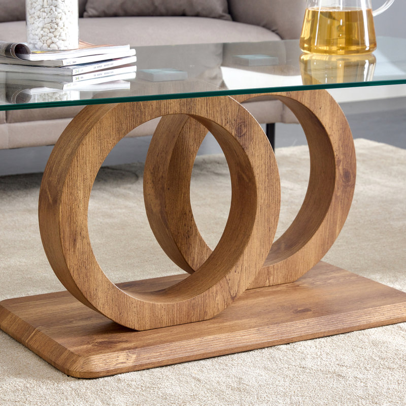 Une table basse rectangulaire moderne et tendance avec un plateau en verre trempé et des pieds en grain de bois. Convient au salon: 47,2 po x 25,4 po x 17,9 po
