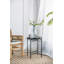 Table d'appoint moderne moderne en teck et en fer avec une silhouette unique et un plateau rond élégant pour une utilisation polyvalente