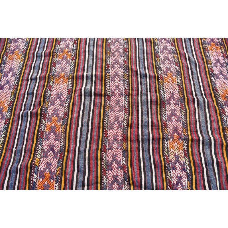 Tapis turc tissé à la main avec un motif rayé coloré dans un motif géométrique éclatant avec des rouges et des oranges riches pour un décor traditionnel