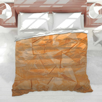 Édredon orange à motif géométrique abstrait