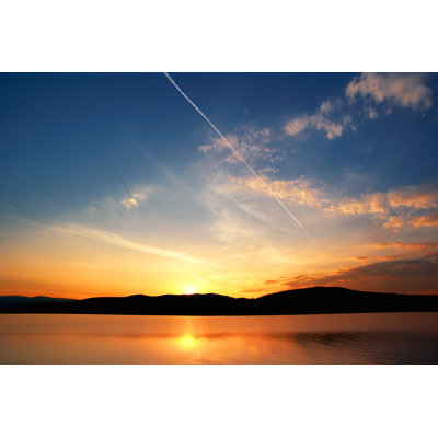 Orange And Blue Sky At Sunset by Ineskoleva - Wrapped Canvas Print
