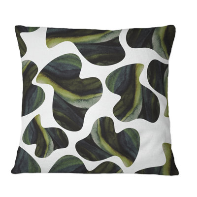 Coussin décoratif à motifs imprimés vert foncé sur fond blanc