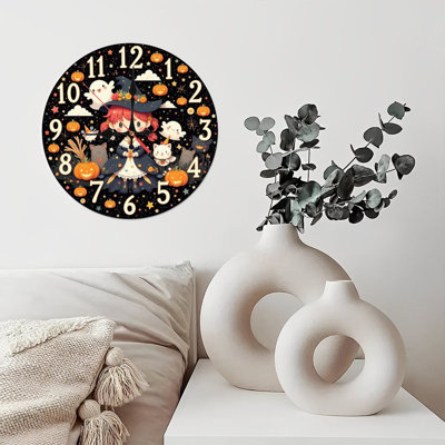 Horloge sorcière avec citrouilles et fantômes