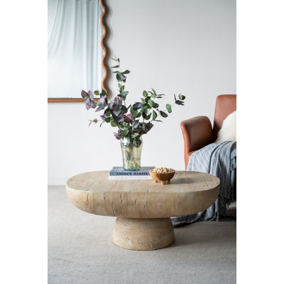 Table basse ovale avec piédestal arrondi