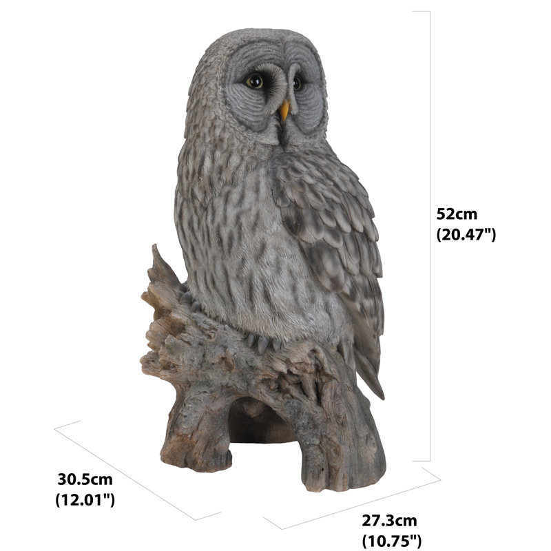 Statue hibou on souches