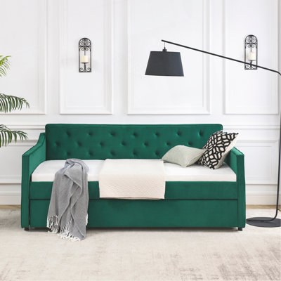 Élégant lit de jour rembourré en velours avec couchette, offrant confort et style pour tout espace.