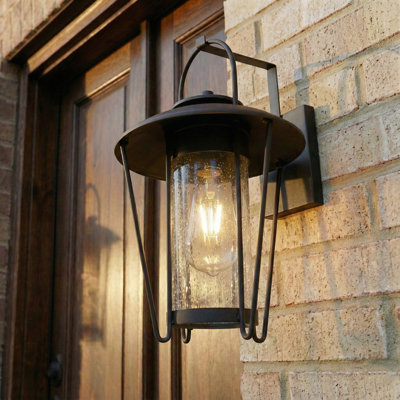 Lanterne murale d'extérieur 1 lumière noire mat 16,75 po avec verre cylindrique ensemencé