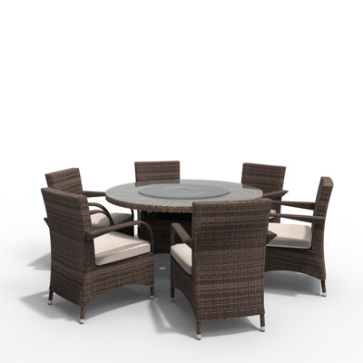 Omied Round 6 - Person 53.15" Long Dining Set with Cushions