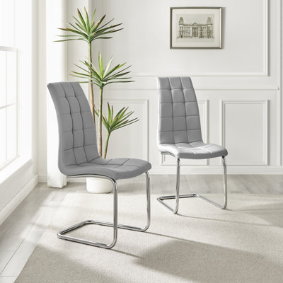 Lenworth Chrome and Glass Rectangular Dining Table Set with 4 Modern Faux Leather Chairs