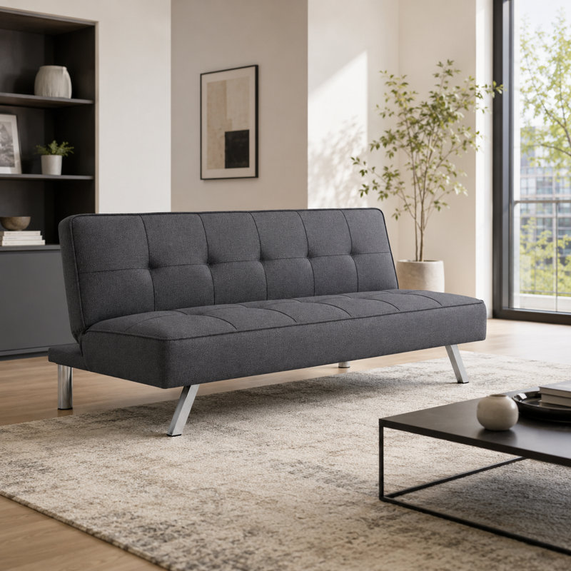 Mobilier gris pliant en tissu à double usage, placé dans le salon, en un clic entre le canapé et le lit
