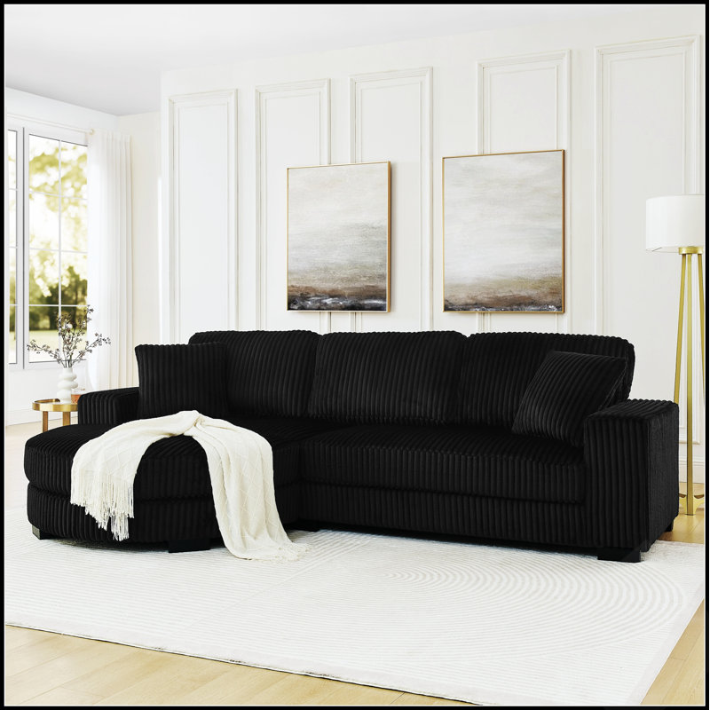 Canapé d'angle convertible en lit capitonné en velours côtelé, en forme de L, avec repose-pieds modulable et positionnable.