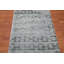 Tapis turquoise touffeté à la main