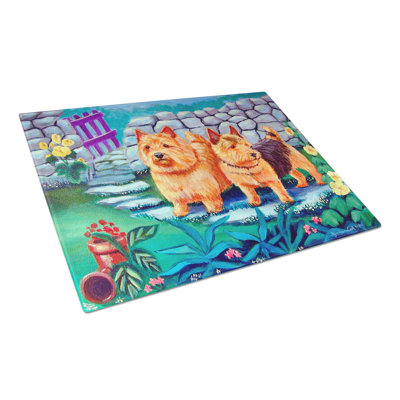 East Urban Home Norwich Terrier Glass Cutting Board